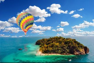 A Solo Hot-Air Ballon Overseeing a Blue Sky and Mother Nature’s island