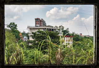 Derelict Building Framed by Window